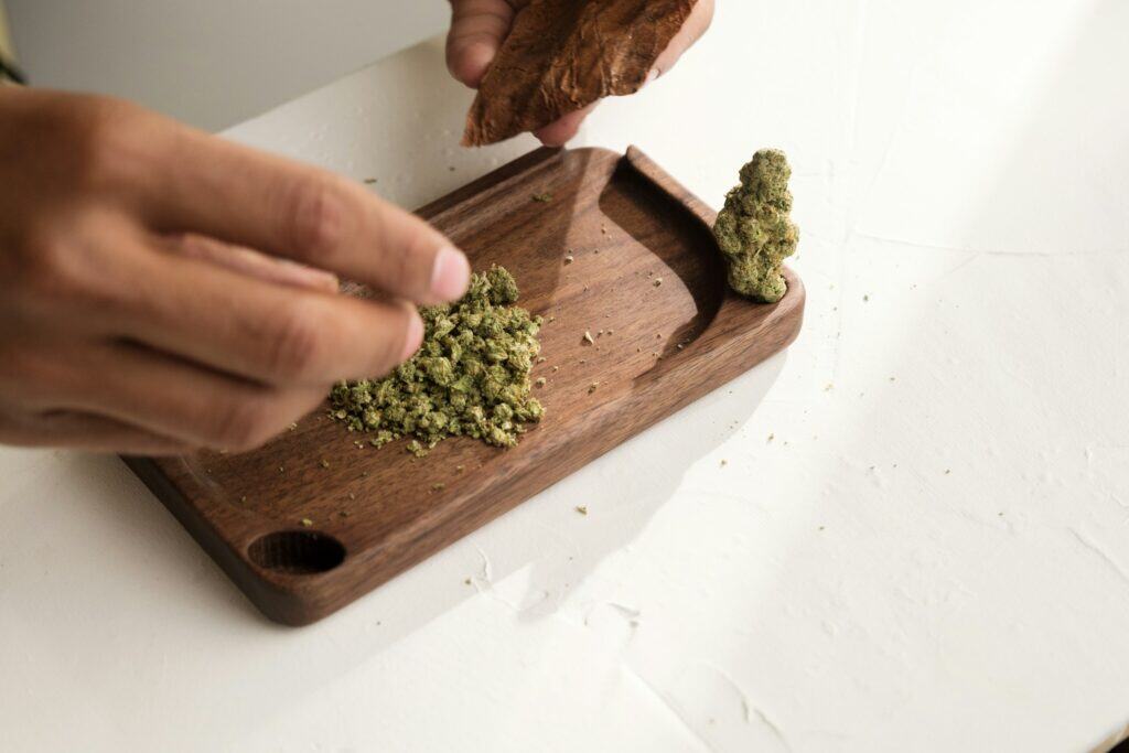 ChiefofLeaf unbroken Chain Strain cannabis on a wooden tray for review.